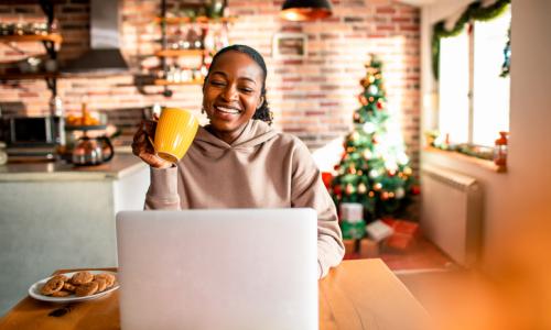 Young woman using a laptop during Christmas