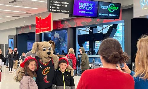 Kids posing with Cavs mascot