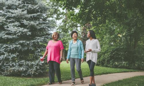 three women walking outside