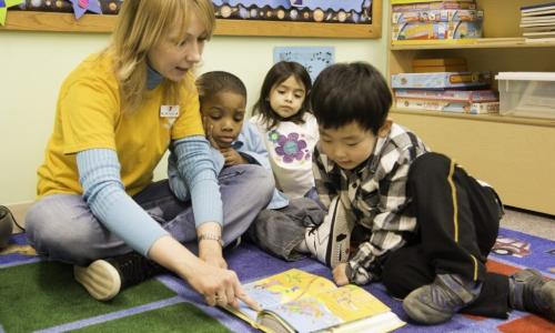 YMCA Child Care Staff reading to children
