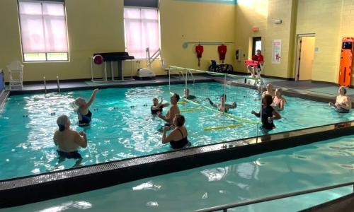 Members playing pool volleyball at The French Creek YMCA