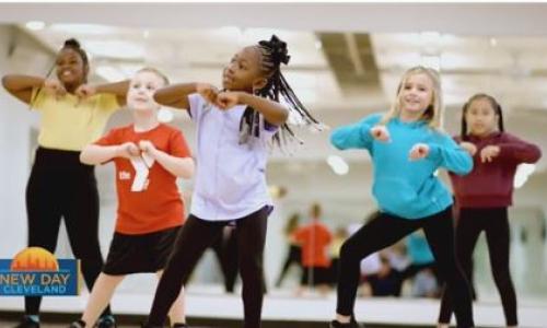Children dance during a summer camp event