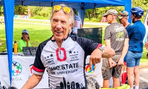 George Zehnder stands with his bicycle after winning Pan Am Masters Games triathalon