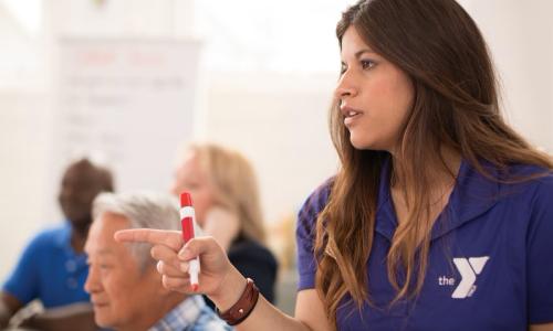 YMCA staff member leads a meeting