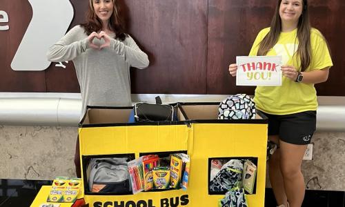 YMCA employees collecting school supplies
