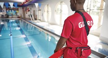 Back of a YMCA life guard on duty