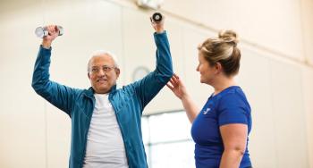 Y-Staff member training an Active Older Adult