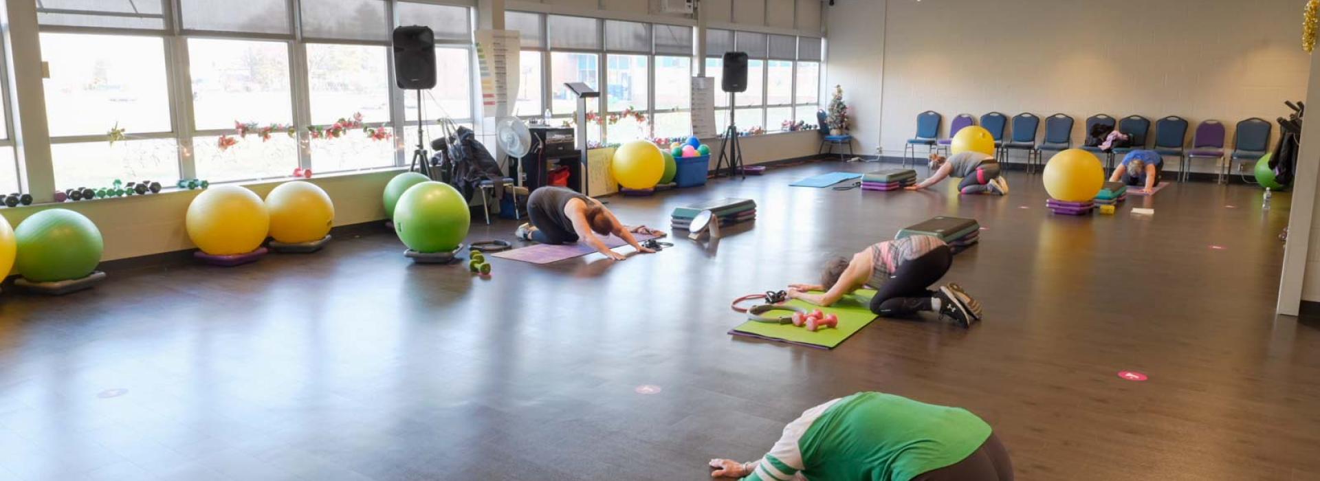class space with members doing yoga